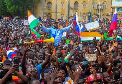 Thousands of anti-sanctions protestors holding Nigerien flags and Russian flags gather in support of the putschist soldiers in the capital Niamey, Niger, on August 20, 2023.