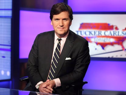 Tucker Carlson poses for photos in a Fox News Channel studio on March 2, 2017, in New York.