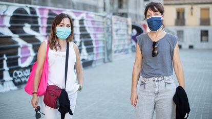 Two women wearing face masks in Barcelona on Tuesday.