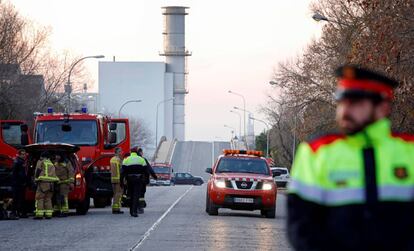 Firefighters and police near the plant where the accident took place.