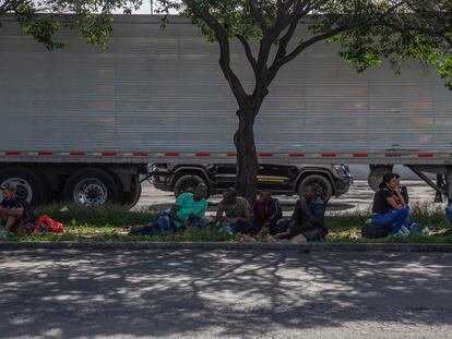 Migrants rest on a median in front of the Northern Bus Station in Mexico City, on September 22, 2023.