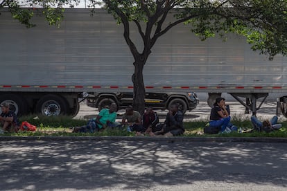 Migrants rest on a median in front of the Northern Bus Station in Mexico City, on September 22, 2023.