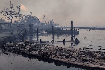 A charred boat lies in the scorched waterfront after wildfires fanned by the winds of a distant hurricane devastated Maui's city of Lahaina, Hawaii, U.S. August 9, 2023. 