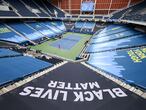 NEW YORK, NEW YORK - AUGUST 31: "Black Lives Matter" and "New York Tough" signage is seen in Louis Armstrong Stadium as Cori Gauff of the United States serves the ball during her Women's Singles first round match against Anastasija Sevastova of Latvia on Day One of the 2020 US Open at the USTA Billie Jean King National Tennis Center on August 31, 2020 in the Queens borough of New York City.   Al Bello/Getty Images/AFP
== FOR NEWSPAPERS, INTERNET, TELCOS & TELEVISION USE ONLY ==