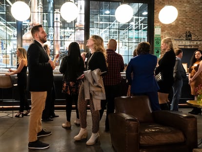 People mingle at a Philadelphia Distilling Daters Mixer Hosted by Date Him Philly, in Philadelphia, Tuesday, Nov. 14, 2023.