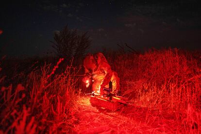 A Ukrainian soldier from the 3rd Assault Brigade prepares a drone with explosives before flying over Russian positions in the Kharkiv region, August 24.