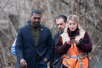 Environmental Protection Agency Administrator Michael Regan left, walks with his staff through East Palestine, Ohio on Thursday, Feb. 16, 2023.