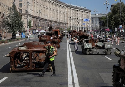 People visit an avenue where destroyed Russian military vehicles have been displayed ahead of the Independence Day in Kyiv, Ukraine.