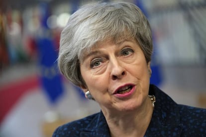 British PM Theresa May speaks to the media as she arrives at the EU Council summit.