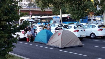 Taxi drivers camp in a central avenue in Madrid.