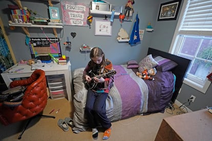 Elle Palmer, 13, plays her mandolin, Monday, Feb. 7, 2023, in Salt Lake City.