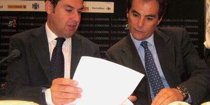 Juan Manuel Moreno y José Antonio Nieto, en un acto reciente.
