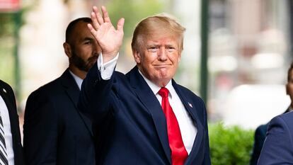 Former President Donald Trump waves as he departs Trump Tower, Wednesday, Aug. 10, 2022, in New York.