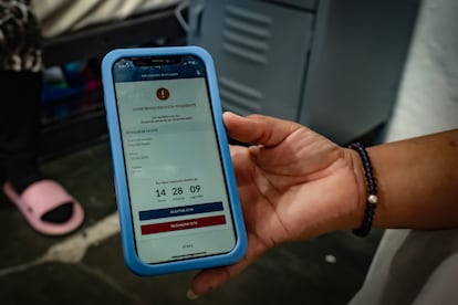 A woman shows her CBP One appointment on her cellphone at a shelter in Ciudad Juárez.