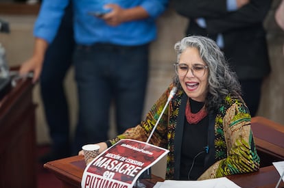 Congress member Maria Jose Pizarro speaks with a massacre of Putumayo banner during the motion to censure to Colombia's Minister of Defense Diego Molano at Colombian congress for a military raid that resulted in 11 death including four suspected civilians alleged by authorities to be passed of by guerilla members, in Bogota, Colombia April 26, 2022. (Photo by Sebastian Barros/NurPhoto via Getty Images)