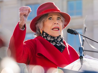 Jane Fonda, with her fist held high, giving a speech about climate change on Friday, December 2, 2022, in Washington.