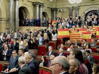 Spanish and Catalan flags on display inside the Catalan parliament after the historic vote on the separatist motion.