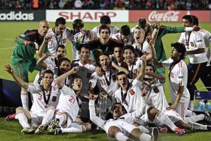 Spain's under-21 players celebrate their European win on the Aarhus Stadium grass.