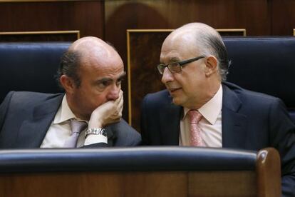 Guindos y Montoro, en el Congreso.