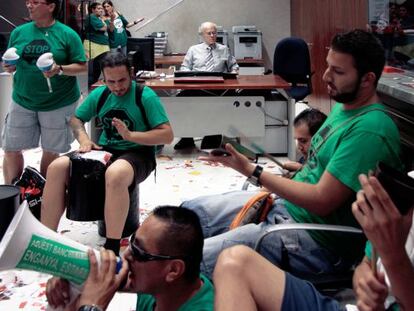 A still from documentary ‘Seven Days,’ showing activists holding a noisy protest in a bank branch.