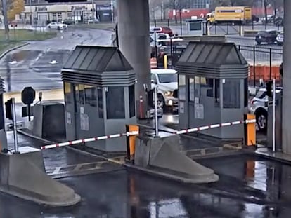 In this photo taken from security video, a light colored vehicle, top left, travels toward the Rainbow Bridge customs plaza, Wednesday, Nov. 22, 2023, in Niagara Falls, N.Y.