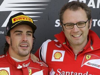 Alonso con el director de Ferrari, Domenicali.