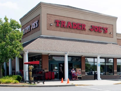 A shopper pushes a cart from the Trader Joe's supermarket on July 28, 2022, in Hadley, Mass.