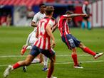 Atletico Madrid's Angel Correa kicks the ball to score his side's first goal during the Spanish La Liga soccer match between Atletico Madrid and Huesca at the Wanda Metropolitano stadium in Madrid, Spain, Thursday, April 22, 2021. (AP Photo/Manu Fernandez)