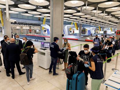 Transportation Minister José Luis Ábalos (2nd l) visits Adolfo Suárez Madrid-Barajas to supervise the introduction of coronavirus security measures.