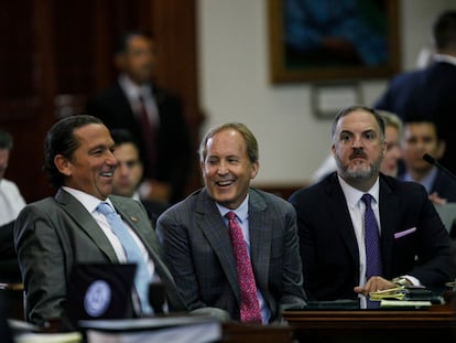 Texas Attorney General Ken Paxton, center, sits between defense attorneys Tony Buzbee, left, and Mitch Little, right, before his impeachment trial resumes in the Senate Chamber at the Texas Capitol on Friday, Sept. 15, 2023, in Austin, Texas.