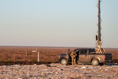 A U.S. Army soldier operates a surveillance truck that he is using at a garbage dump as a base on the U.S.-Mexico border.