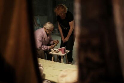 Former engineer Maria Nikolaevna, 92, eats as her daughter Natalya, 58, watches, inside a basement where they have lived since the beginning of the war, in northern Saltivka, one of the most damaged residential areas of Kharkiv, Ukraine July 22, 2022. With both their homes now uninhabitable, the family lives in limbo in the cellar of a friend's apartment block. REUTERS/Nacho Doce   SEARCH "DOCE UKRAINE NIKOLAEVNA" FOR THIS STORY. SEARCH "WIDER IMAGE" FOR ALL STORIES.