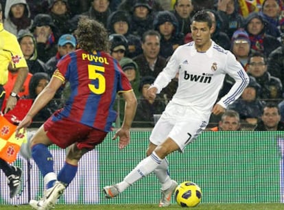 Ronaldo and Puyol during the most recent Barcelona-Real Madrid Liga match.