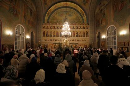 Russian Orthodox believers attend a Christmas service at the Church of the Holy Martyrs Florus and Laurus on Zatsep in Moscow, Russia.