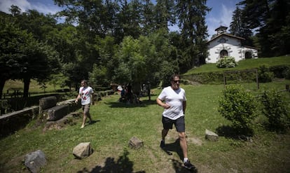 Two men take a stroll around the only hamlet in the valley of Artikutza.