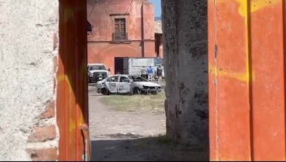 A burned car inside the property.