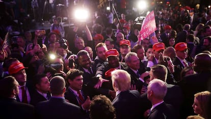 Donald Trump greets supporters following his election win.