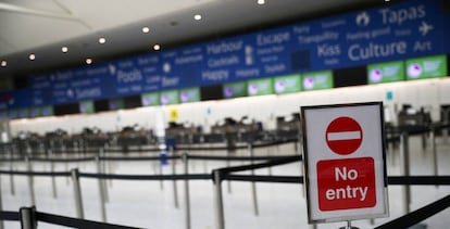 A baggage check-in point at Gatwick Airport in the UK.