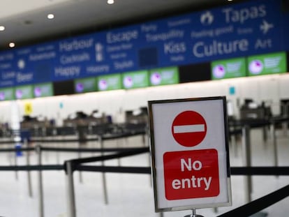 A baggage check-in point at Gatwick Airport in the UK.