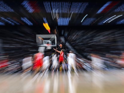 A slow exposure with zoom effect picture shows Moritz Wagner (C) of Germany in action during the International Basketball Week game between USA and Germany in Abu Dhabi, United Arab Emirates, 20 August 2023.
