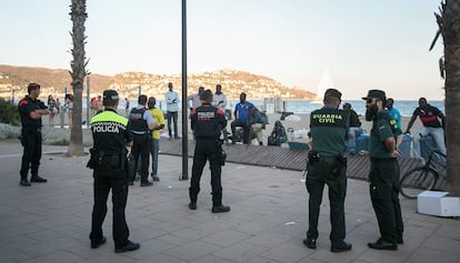 Local police officers and Civil Guards in the Catalan resort town of Roses.