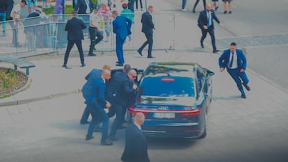 Security officers move Slovak PM Robert Fico in a car after he was injured in a shooting incident, after a Slovak government meeting in Handlova, Slovakia, May 15, 2024.