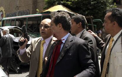 Fernando Londo&ntilde;o is led to an ambulance after Tuesday&#039;s explosion.