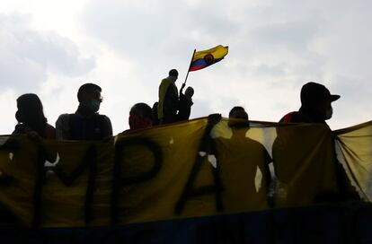 Protesters wave a flag during a protest against the tax reform of President Ivan Duque's government in Bogota, Colombia, May 1, 2021. REUTERS/Luisa Gonzalez