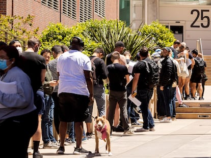 People stand in long lines to receive the monkeypox vaccine at San Francisco General Hospital in San Francisco, Tuesday, July 12, 2022. (Jessica Christian/San Francisco Chronicle via AP)