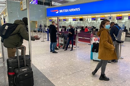 UK travelers returning to their homes in Spain wait to speak to airline staff after being refused boarding at London's Heathrow airport on January 2.