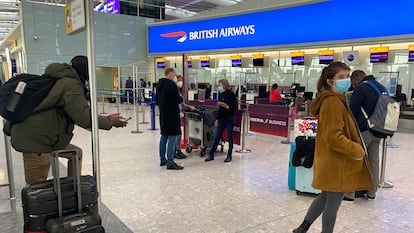 UK travelers returning to their homes in Spain wait to speak to airline staff after being refused boarding at London's Heathrow airport on January 2.