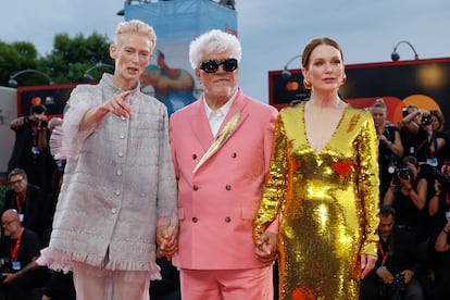 Tilda Swinton, from left, director Pedro Almodovar, and Julianne Moore pose for photographers upon arrival for the premiere of the film 'The Room Next Door' during the 81st edition of the Venice Film Festival in Venice, Italy, on Monday, Sept. 2, 2024. (Photo by Joel C Ryan/Invision/AP)