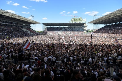 St. Pauli fans celebrate on the Millerntor-Stadion pitch in Hamburg, Germany, on May 12.
