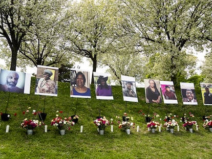 Flowers are placed near photographs of the victims killed in last year's racist massacre at a Buffalo supermarket as their lives are commemorated during the 5/14 Community Gathering for Reflection, Healing, and Hope at the Johnnie B. Wiley Amateur Athletic Sports Pavilion in Buffalo, N.Y. on Saturday, May 13, 2023.